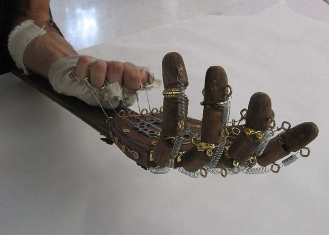 A wooden, hand-powered mechanical hand 1879